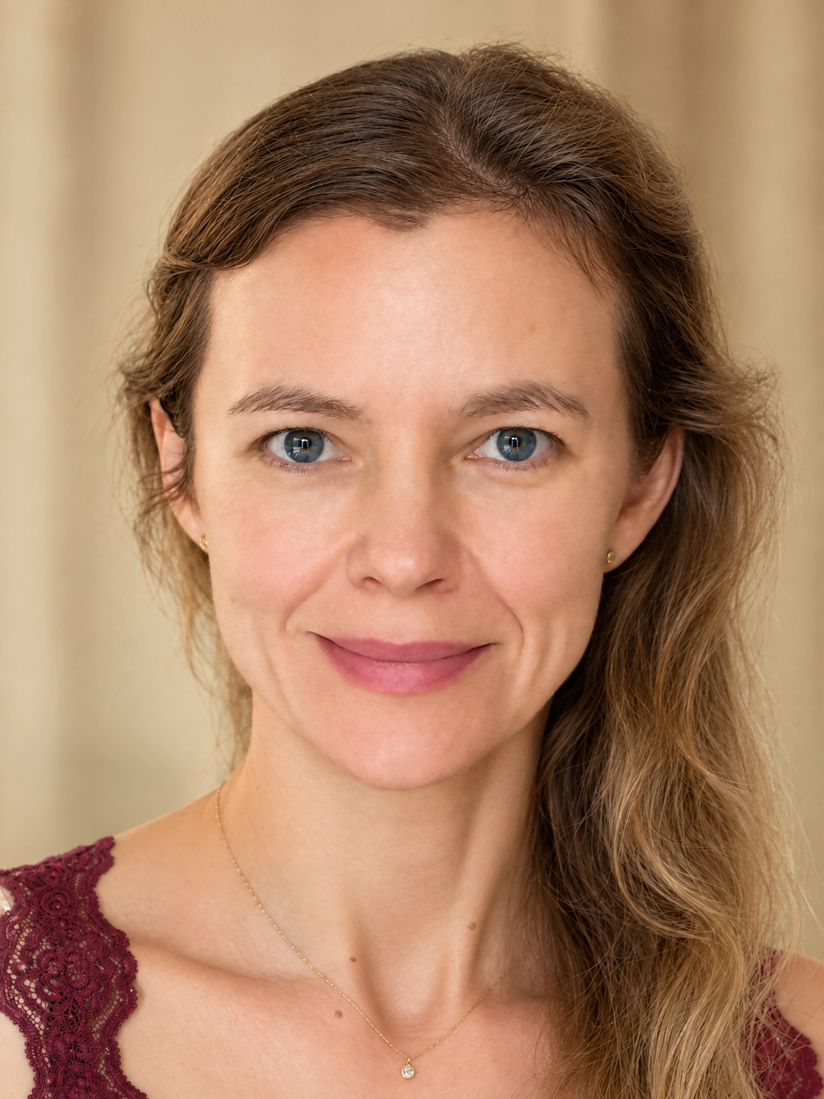 Close-up portrait of Dr. Kasia Wezowski with naturally luminous skin